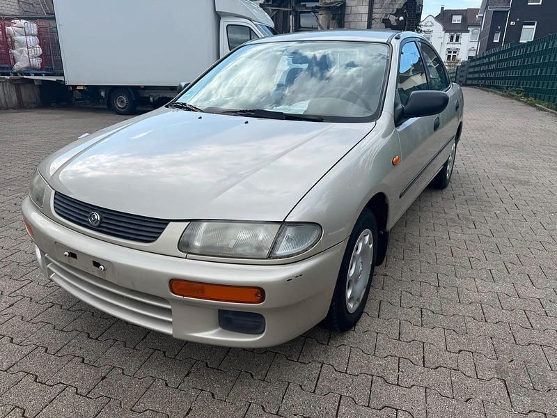 Second-hand Mazda 323 88 CP (64 kW) 1996 Auriu Berlinǎ