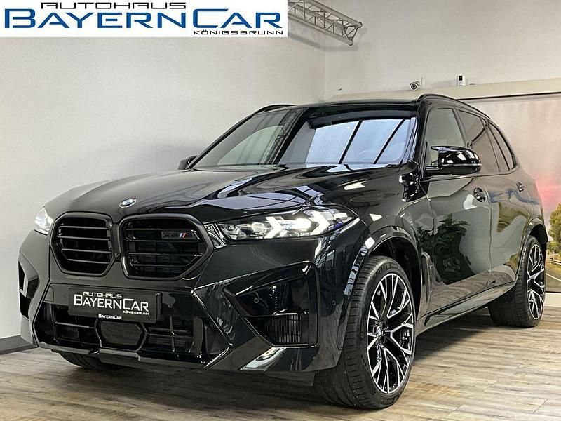 Black sapphire metallic Gebraucht 2024 BMW X5 M Comfort Edition SUV | 123.989 € - Bild 1/4
