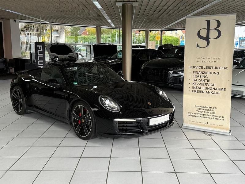 Tiefschwarzmetallic Gebraucht 2017 Porsche 911 Carrera 4 Cabriolet Chrono Cabrio | 99.900 € (Guter Preis) - Bild 1/4