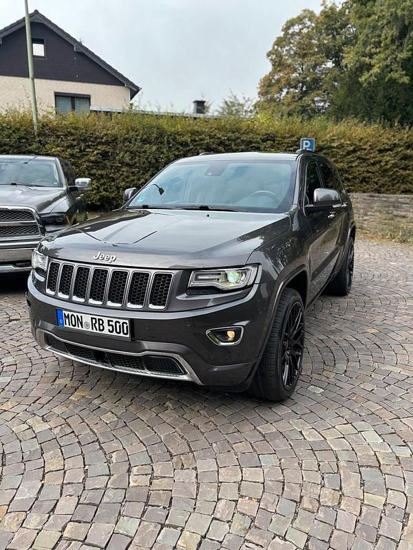 Grau Gebraucht 2013 Jeep Grand Cherokee Overland SUV | 17.800 € - Bild 1/4