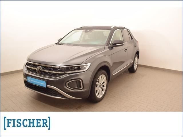 Indiumgrau metallic (grau) Gebraucht 2023 VW T-Roc Style SUV | 26.876 € (Guter Preis) - Bild 1/4