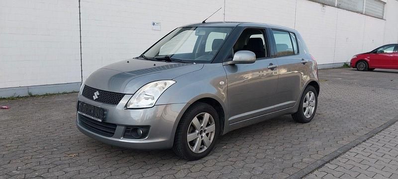Grau Gebraucht 2009 Suzuki Swift Kleinwagen | 4.999 € (Fairer Preis) - Bild 1/4