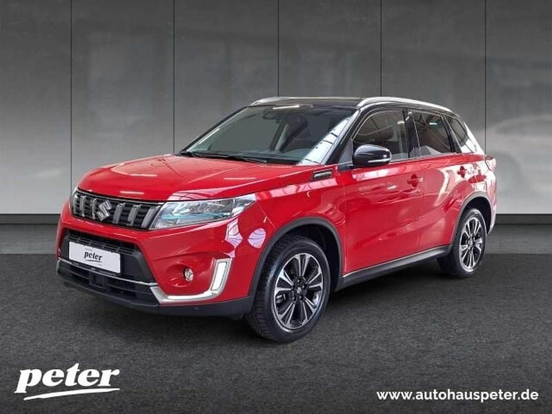 Bright red/cosmic black Gebraucht 2023 Suzuki Vitara Comfort+ SUV | 22.440 € (Fairer Preis) - Bild 1/4