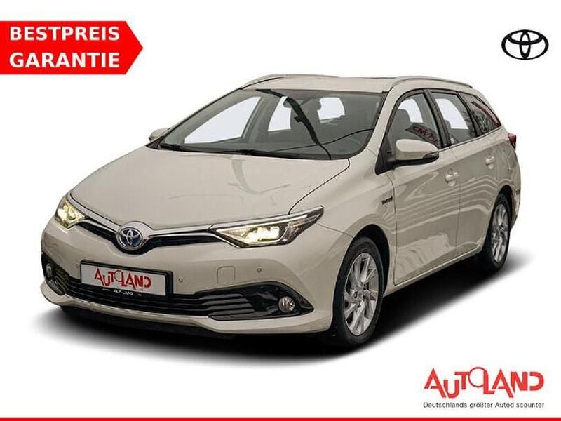 Weiß Gebraucht 2016 Toyota Auris Hybrid Edition-S Kombi | 13.990 € (Fairer Preis) - Bild 1/4