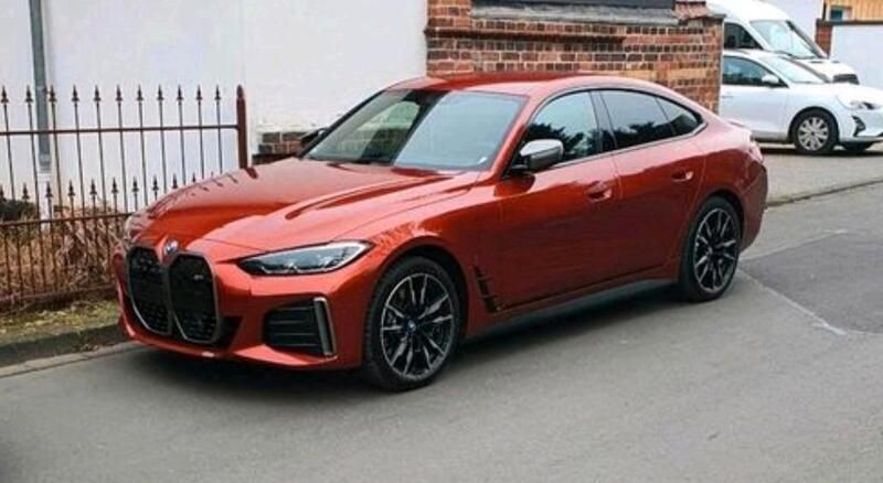 Orange Gebraucht 2024 BMW i4 Efficient Dynamics Limousine | 55.000 € (Fairer Preis) - Bild 1/2