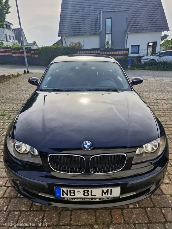 Gebraucht BMW 116 122 PS (89 kW) 2009 Schwarz Kleinwagen