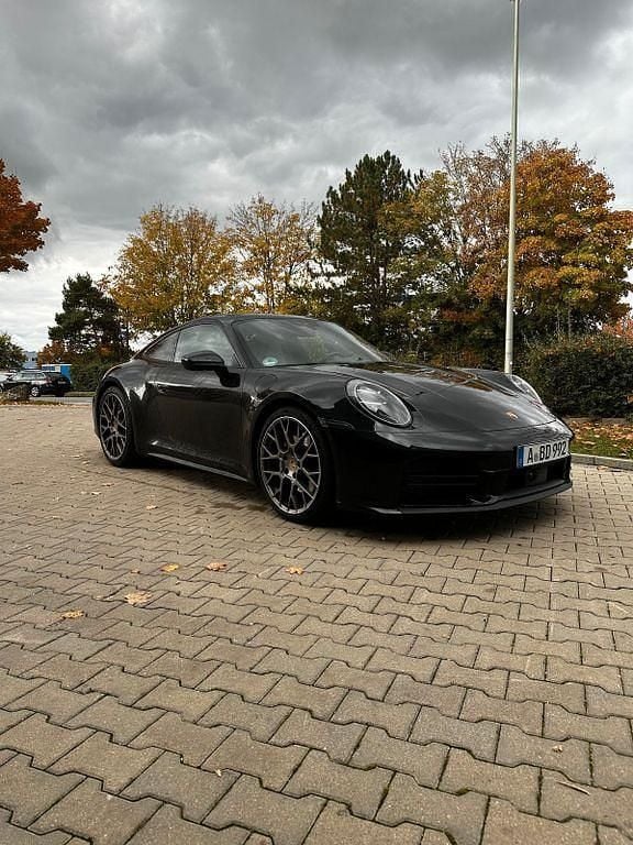 Schwarz Gebraucht 2024 Porsche 911 Carrera Coupé | 140.000 € (Superpreis) - Bild 1/4