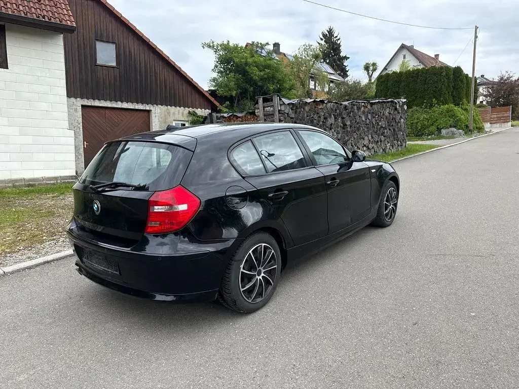 Second-hand BMW 116 122 CP (89 kW) 2009 Negru Hatchback