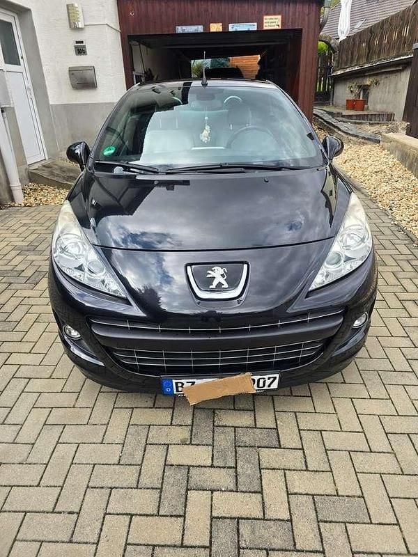 Schwarz Gebraucht 2012 Peugeot 207 CC Roland Garros Cabrio | 4.001 € (Superpreis) - Bild 1/4