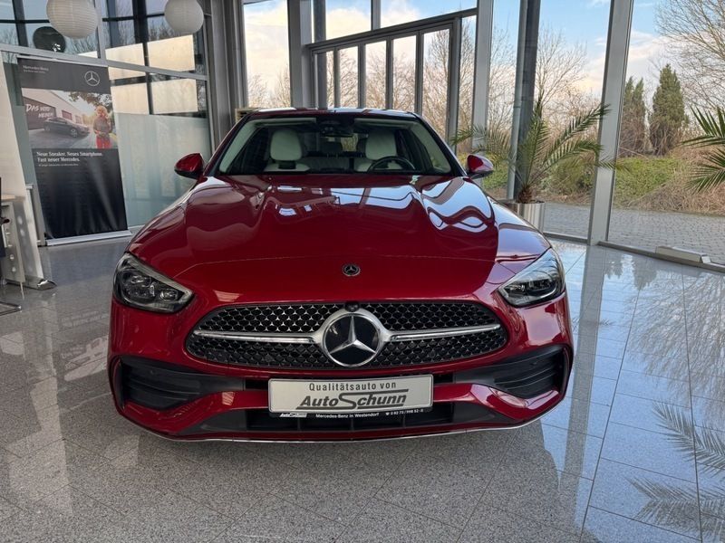 Gebraucht Mercedes C200 AMG 204 PS (150 kW) 2024 Patagonienrot  metalliclack Limousine