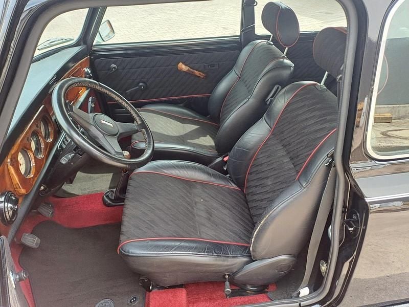 Second-hand Mini 1300 63 CP (46 kW) 1994 Negru Hatchback