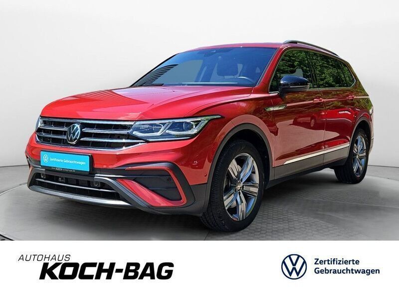 Kings red metallic Gebraucht 2024 VW Tiguan Allspace Move SUV | 41.995 € (Fairer Preis) - Bild 1/4