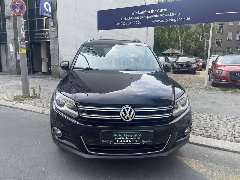 Deep black (metallic) Gebraucht 2015 VW Tiguan Cup SUV | 10.990 € (Guter Preis) - Bild 1/4