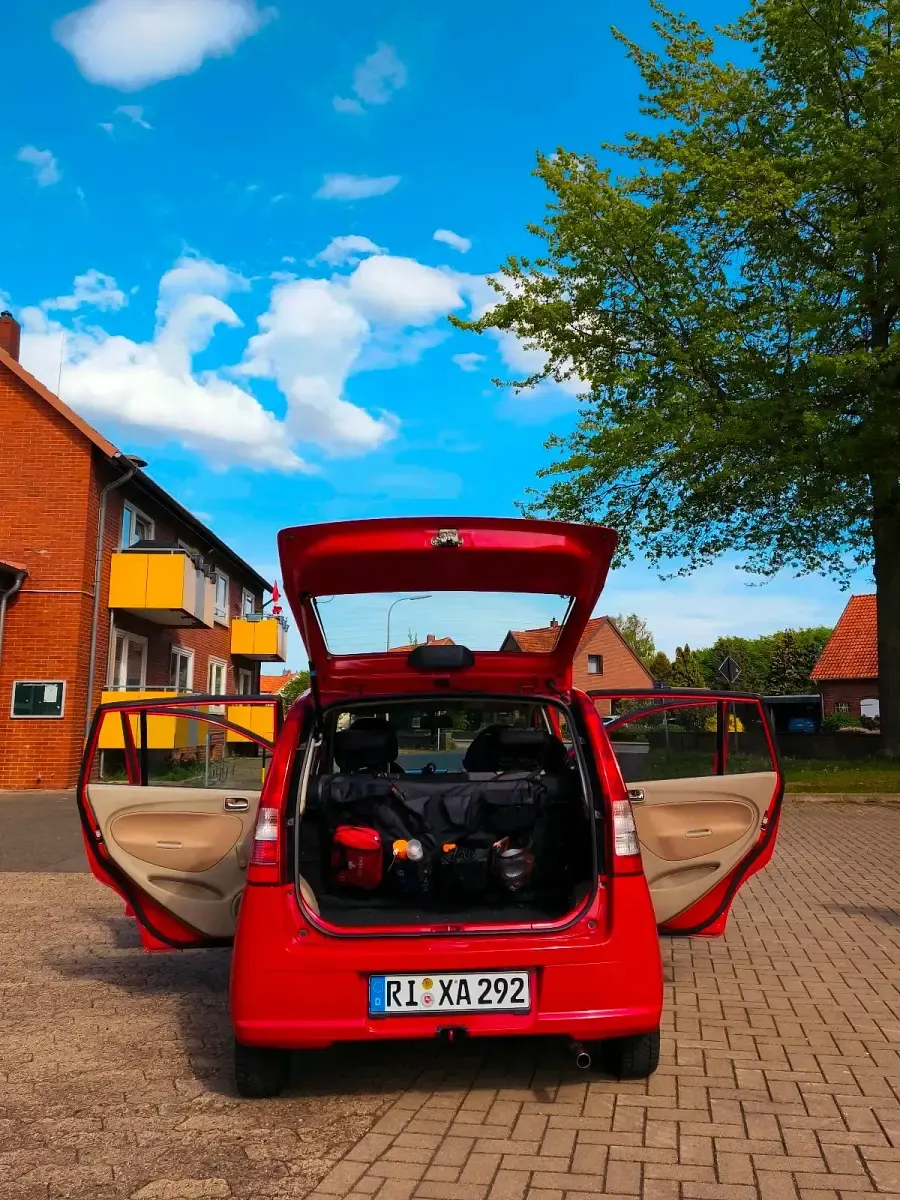Gebraucht Daihatsu Cuore 58 PS (42 kW) 2006 Rot Kleinwagen