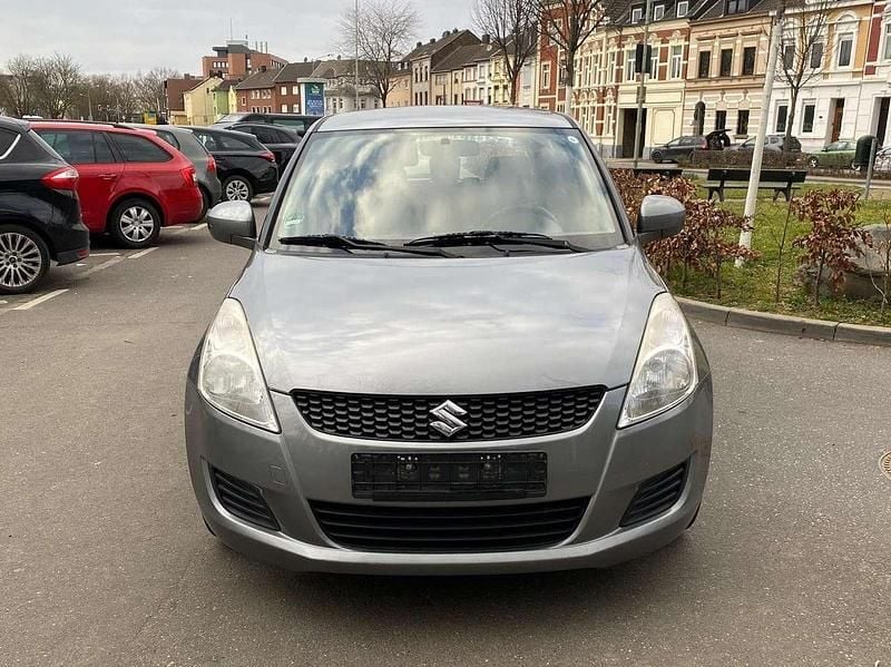 Grau Gebraucht 2011 Suzuki Swift Comfort Limousine | 3.599 € (Fairer Preis) - Bild 1/4
