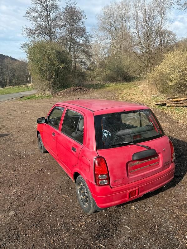 Gebraucht Daihatsu Cuore 56 PS (41 kW) 2002 Rot Kleinwagen
