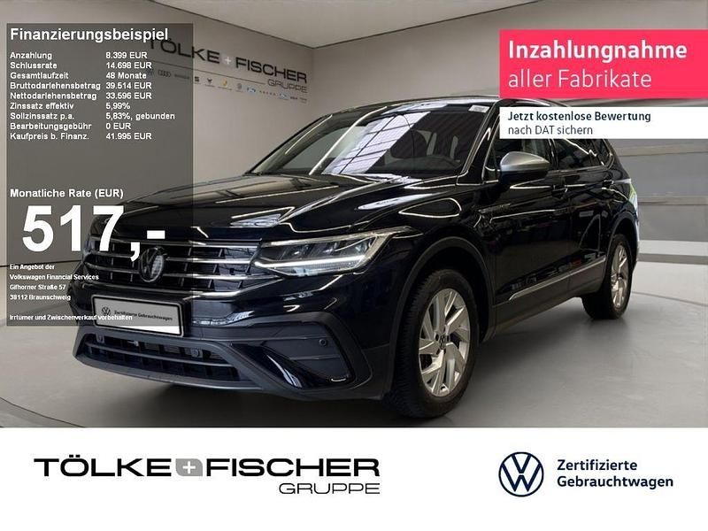 Deep black perleffekt (metallic) Gebraucht 2024 VW Tiguan Allspace Life SUV | 42.959 € (Fairer Preis) - Bild 1/4