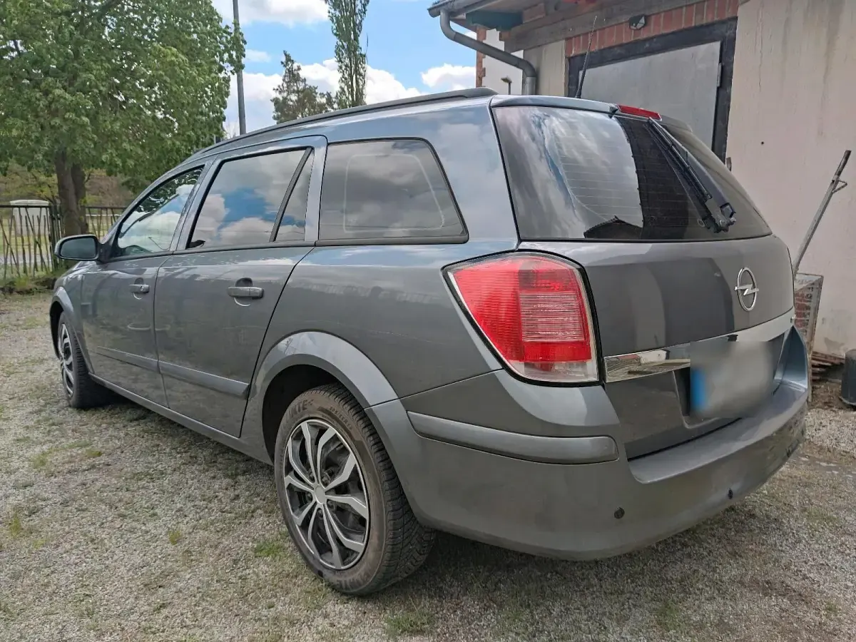 Używany Opel Astra 75 KM (55 kW) 2004 Purpurowy Kombi