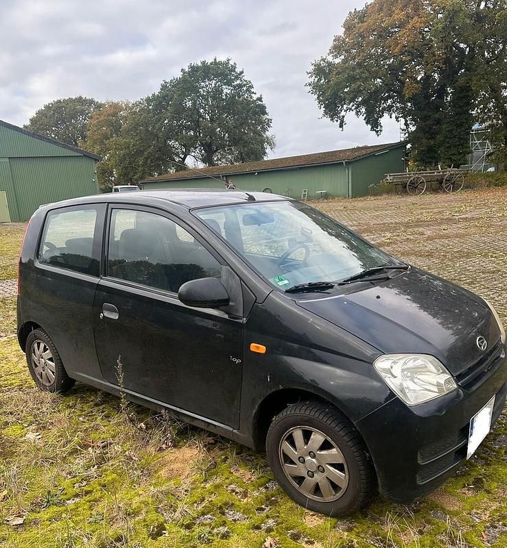 Schwarz Gebraucht 2005 Daihatsu Cuore Kleinwagen | 1.900 € - Bild 1/4