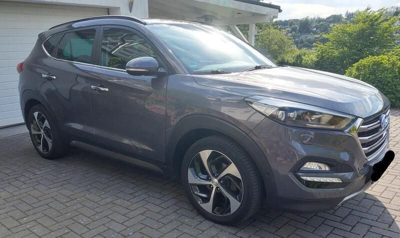 Grau Gebraucht 2016 Hyundai Tucson Premium SUV | 15.400 € (Guter Preis) - Bild 1/4