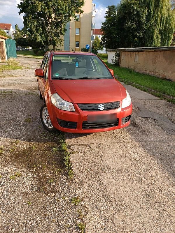 Orange Gebraucht 2009 Suzuki SX4 Limousine | 2.700 € (Fairer Preis) - Bild 1/4