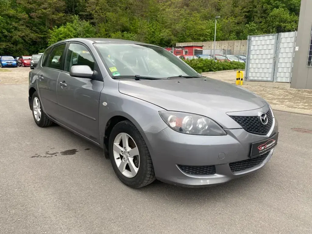 Używany Mazda 3 Comfort 105 KM (77 kW) 2004 Szary Sedan/Limuzyna