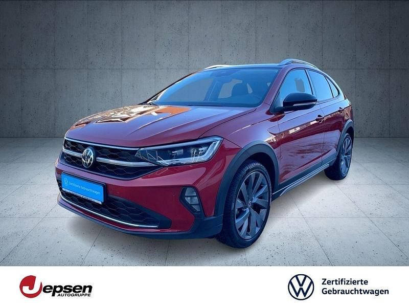 Kings red metallic//deep black Gebraucht 2022 VW Taigo Style SUV | 22.970 € (Fairer Preis) - Bild 1/4