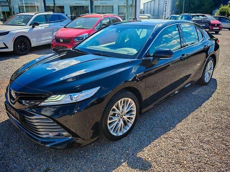 Schwarz Gebraucht 2021 Toyota Camry Hybrid Executive Limousine | 27.490 € - Bild 1/4