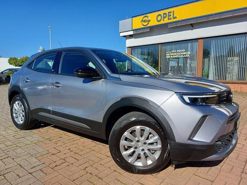 Gebraucht Opel Mokka-e Edition 100 kW (136 PS) 2021 Kontrast grau/quarz silber SUV