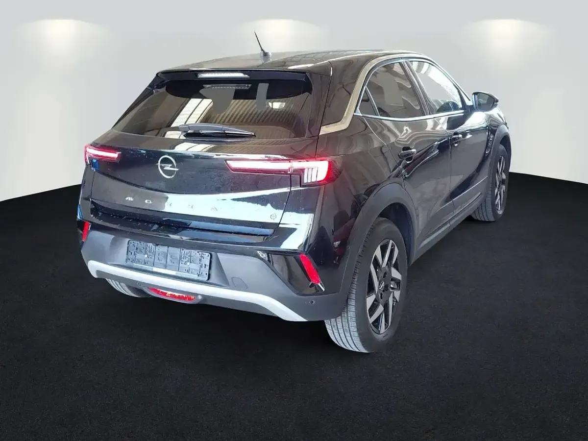 Gebraucht Opel Mokka-e Elegance 100 kW (136 PS) 2022 Diamant schwarz/karbon schwarz (metallic) SUV