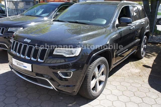 Schwarz metallic Gebraucht 2013 Jeep Grand Cherokee Overland SUV | 36.900 € - Bild 1/4