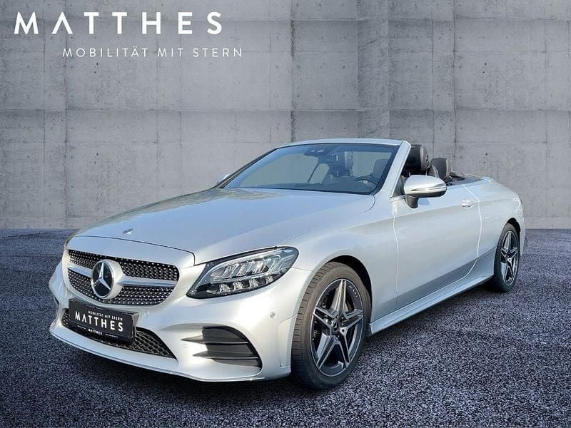 Iridiumsilber (metallic) Gebraucht 2020 Mercedes C180 AMG Cabrio | 32.900 € (Fairer Preis) - Bild 1/4