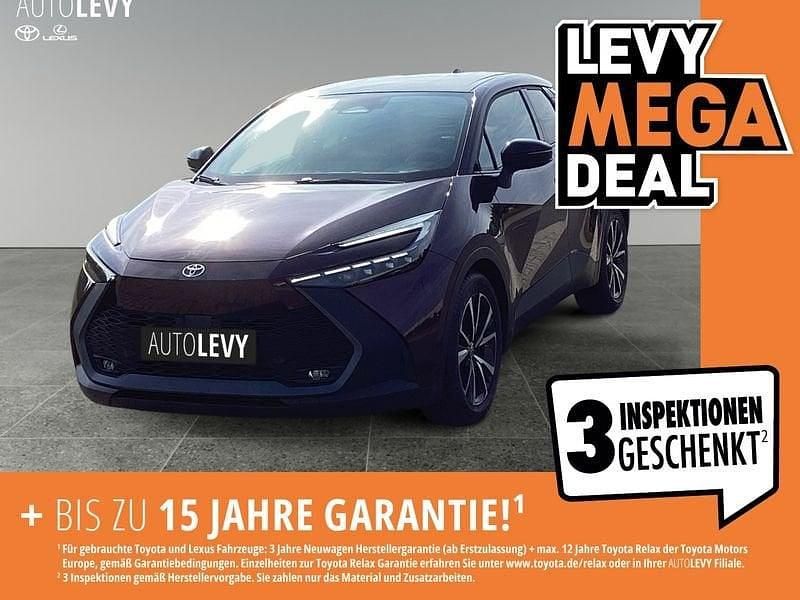 Dunkel amethyst metallic/ dach schwarz Gebraucht 2024 Toyota C-HR Team SUV | 27.490 € (Guter Preis) - Bild 1/4