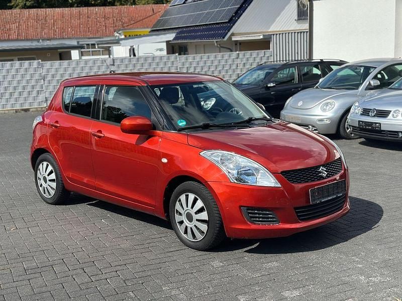 Orange Gebraucht 2012 Suzuki Swift Club Limousine | 5.400 € (Fairer Preis) - Bild 1/4