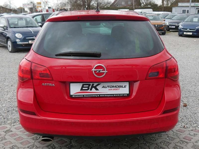 Gebraucht Opel Astra 120 PS (88 kW) 2011 Power rot/traffic red ral3020 Kombi