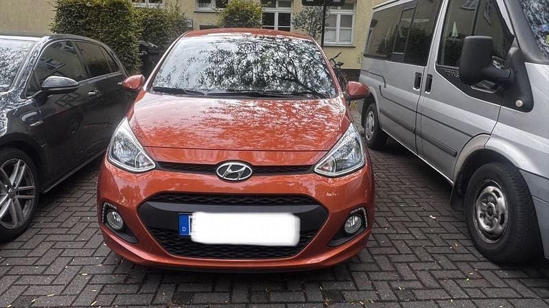 Orange Gebraucht 2014 Hyundai i10 Edition Kleinwagen | 7.777 € (Fairer Preis) - Bild 1/4