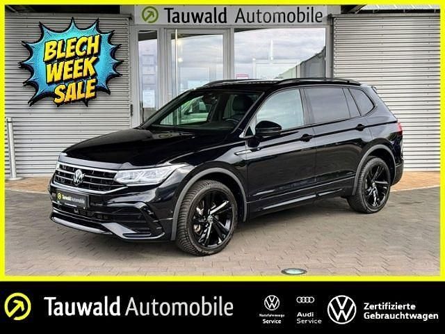 Schwarz (deep black perleffekt) Gebraucht 2023 VW Tiguan Allspace R-line SUV | 40.810 € (Fairer Preis) - Bild 1/4