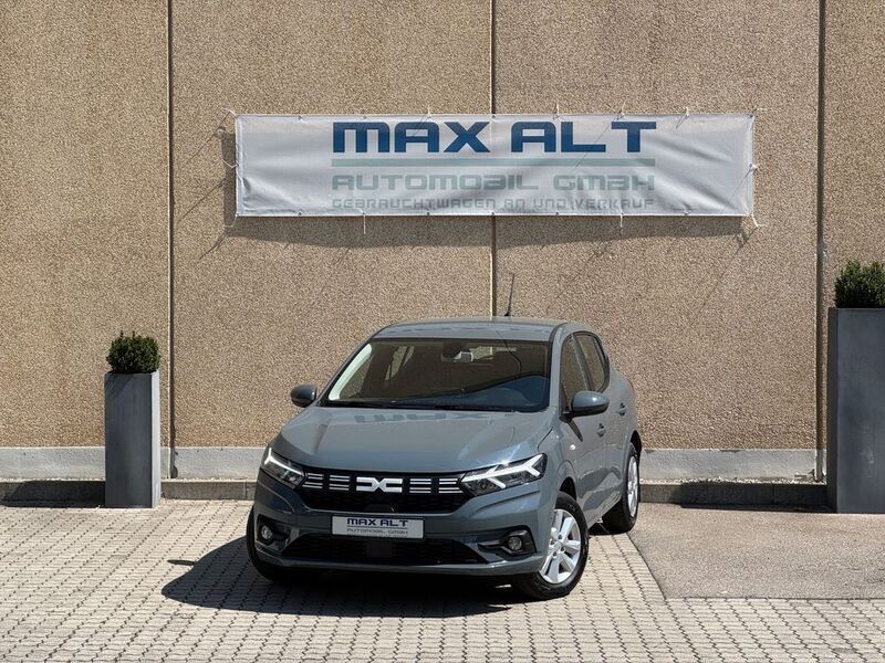 Städtisches grau Gebraucht 2023 Dacia Sandero Expression Kleinwagen | 12.970 € (Superpreis) - Bild 1/4