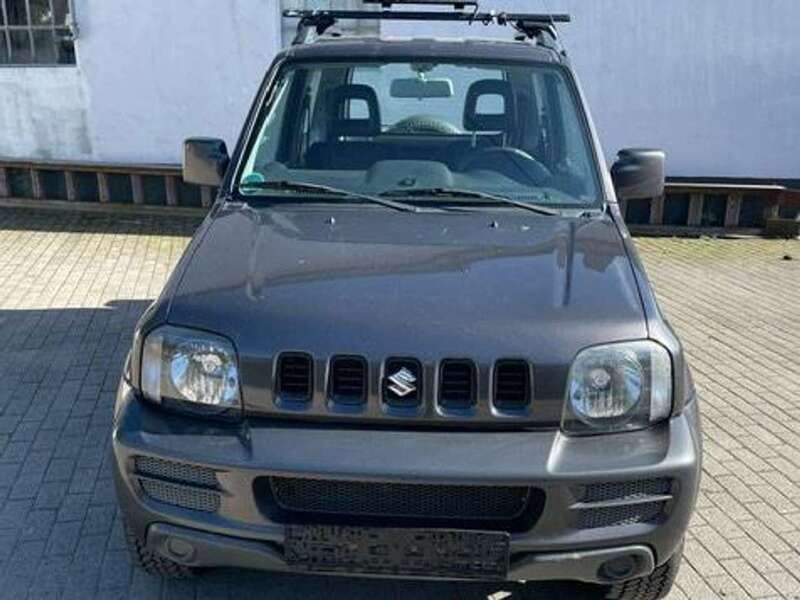 Grau Gebraucht 2011 Suzuki Jimny Ranger SUV | 7.350 € (Fairer Preis) - Bild 1/4