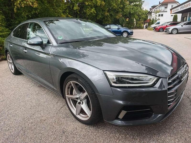 Monsungrau metallic Gebraucht 2019 Audi A5 Sportback Sport Coupé | 27.990 € (Guter Preis) - Bild 1/4