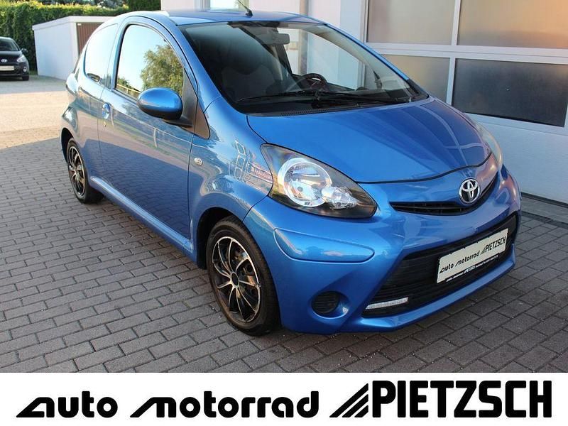Electra blue Gebraucht 2012 Toyota Aygo Cool Kleinwagen | 4.990 € (Fairer Preis) - Bild 1/4