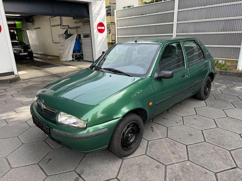 Grün Gebraucht 1996 Mazda 121 Kleinwagen | 1.690 € - Bild 1/4