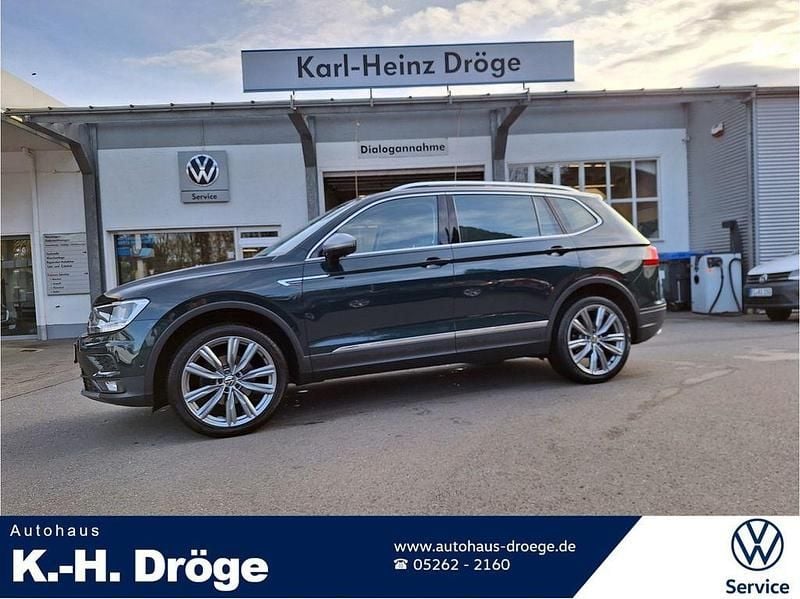 Dark moss green metallic Gebraucht 2019 VW Tiguan Allspace Comfortline SUV | 18.780 € (Fairer Preis) - Bild 1/4
