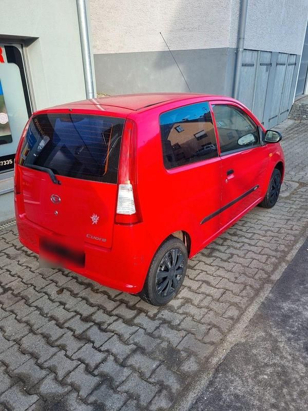 Gebraucht Daihatsu Cuore 58 PS (42 kW) 2005 Rot Kleinwagen