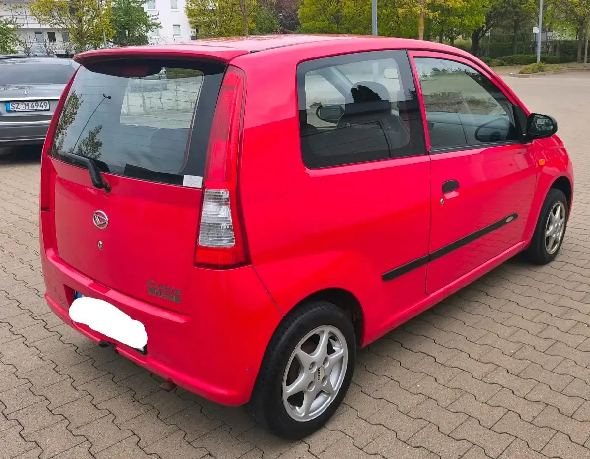 Gebraucht Daihatsu Cuore 58 PS (42 kW) 2005 Rot Kleinwagen