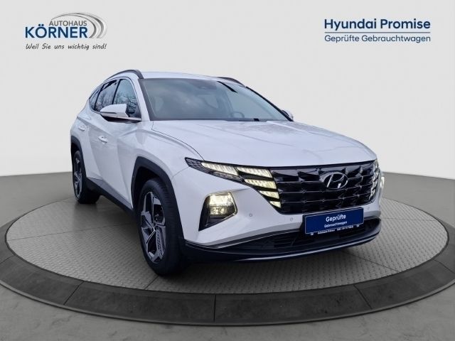 Polar white / sol (weiss) Gebraucht 2021 Hyundai Tucson Prime SUV | 27.400 € (Fairer Preis) - Bild 1/4