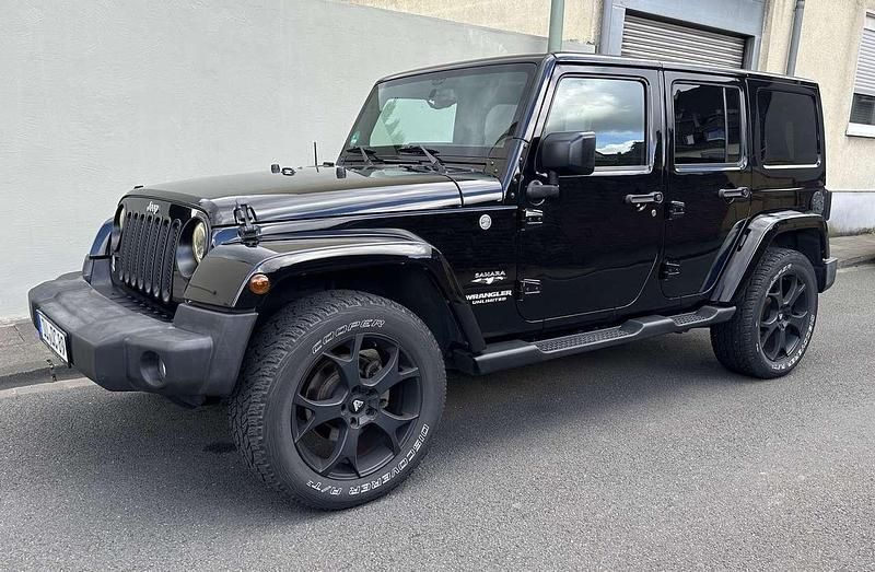 Schwarz Gebraucht 2017 Jeep Wrangler Unlimited Sahara SUV | 36.999 € (Etwas zu teuer) - Bild 1/3