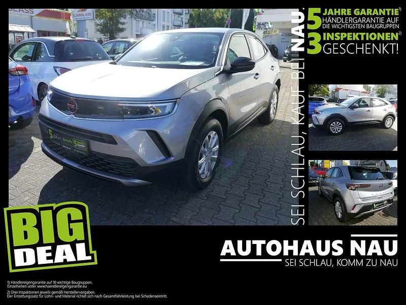 Lack grau artense/typ aussenve Gebraucht 2023 Opel Mokka Enjoy SUV | 18.490 € (Fairer Preis) - Bild 1/4