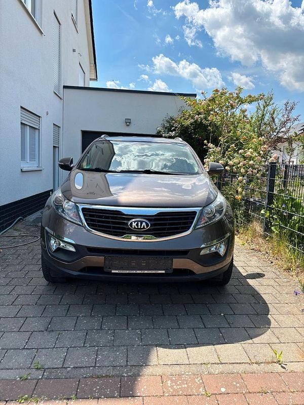 Braun Gebraucht 2013 Kia Sportage Vision SUV | 7.999 € (Guter Preis) - Bild 1/4