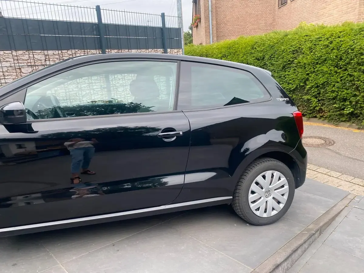 Gebraucht VW Polo Team 60 PS (44 kW) 2011 Schwarz Kleinwagen